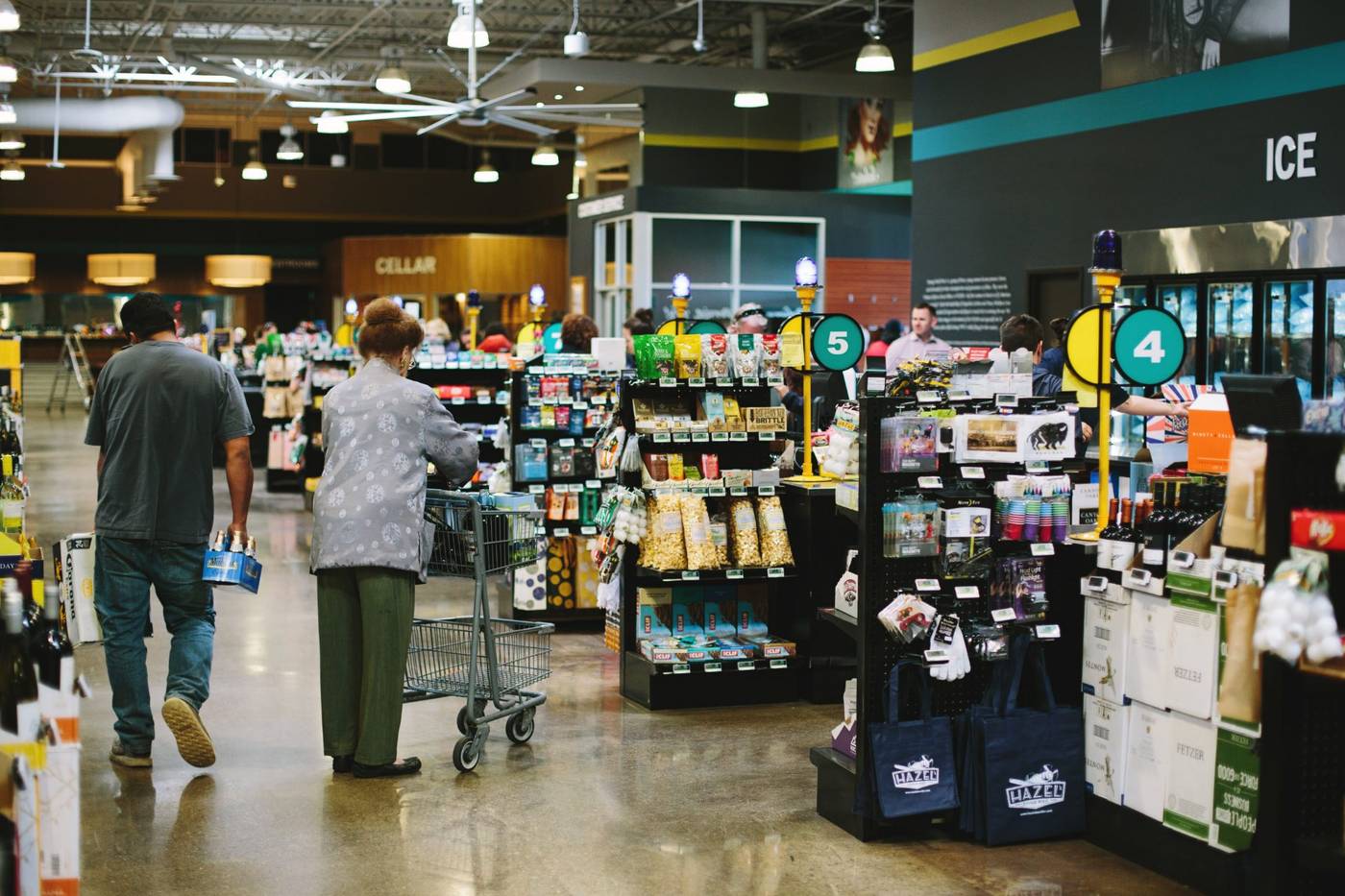 Shoppers browsing the aisle of a real mPower customer store